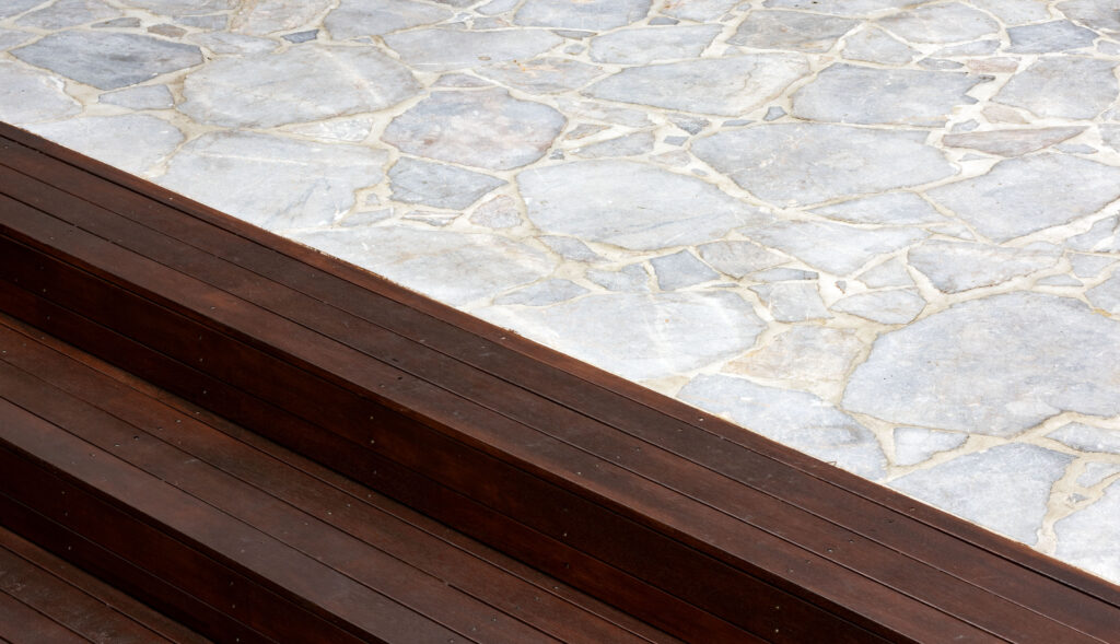 Landscape design and construct project in New Lambton completed with a timber pergola, crazy pave, synthetic turf, and an outdoor entertainment area.