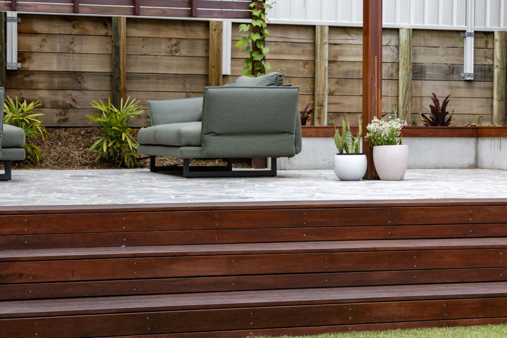 Landscape design and construct project in New Lambton completed with a timber pergola, crazy pave, synthetic turf, and an outdoor entertainment area.