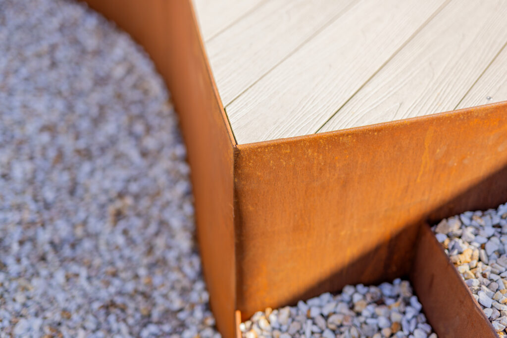 Detail of corten steel edging and composite decking corner, Corlette native garden