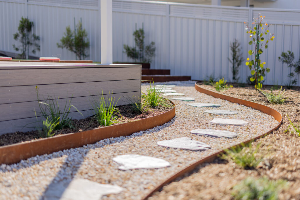 Close-up of curved garden path and native planting, Corlette landscape design