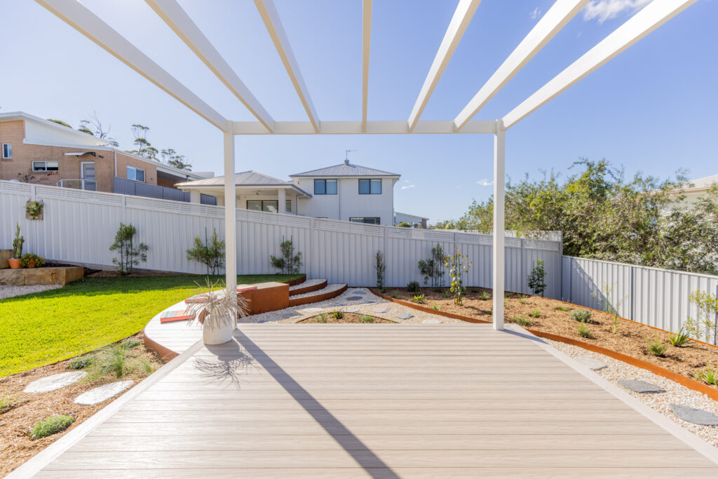 View from under the pergola over the native garden design Corlette rear yard