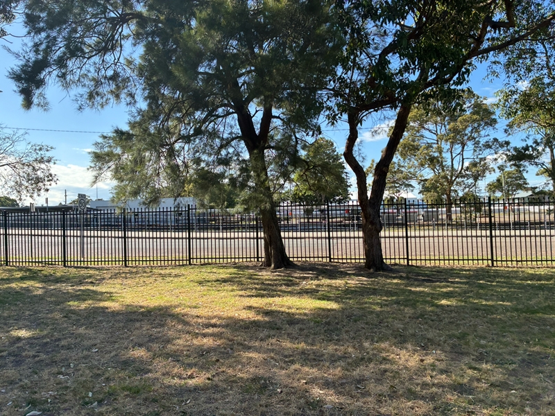 Empty school field before the natural play space design at Hamilton North Public School