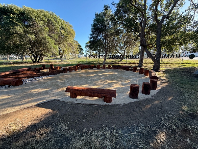 Finished yarning circle with timber log seating at Hamilton North Public School