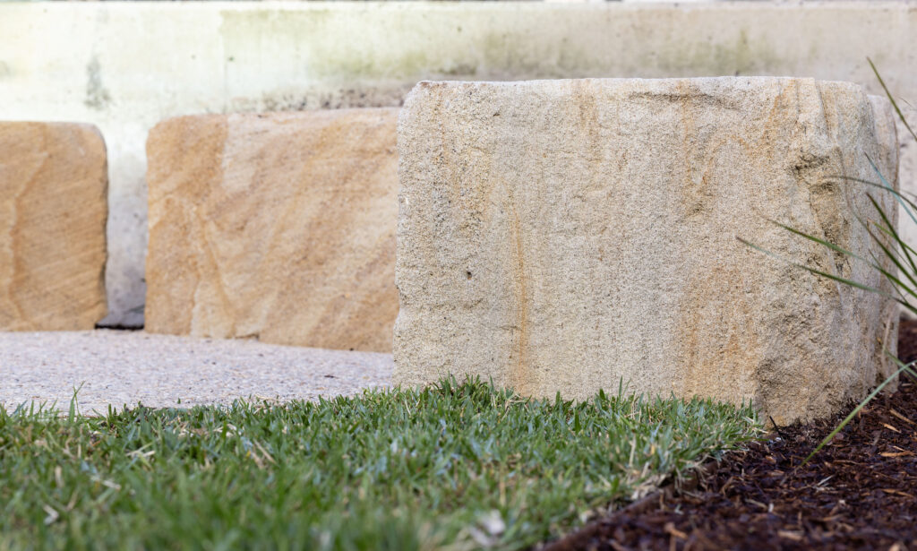Close-up of natural sandstone texture and grain on the seating blocks at John Hunter Hospital
