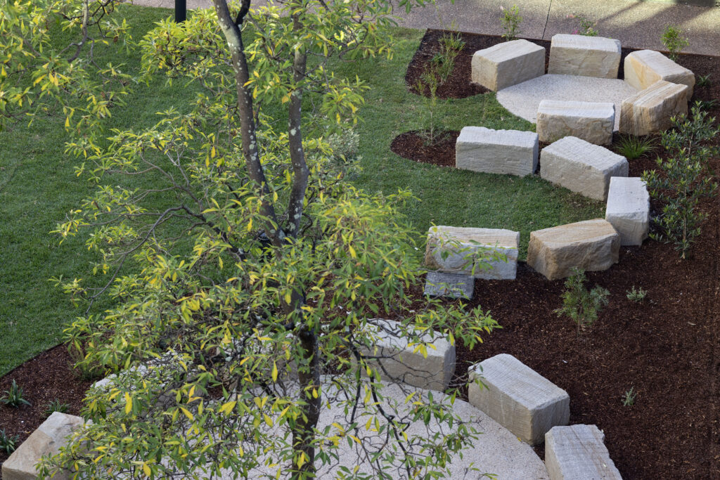 Aerial view of the curved sandstone seating path at John Hunter Hospital's cultural connection space