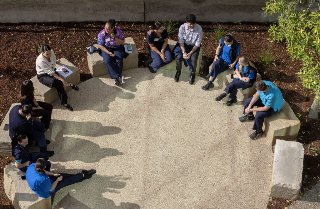 Aerial view of hospital staff meeting in the yarning circle at John Hunter Hospital