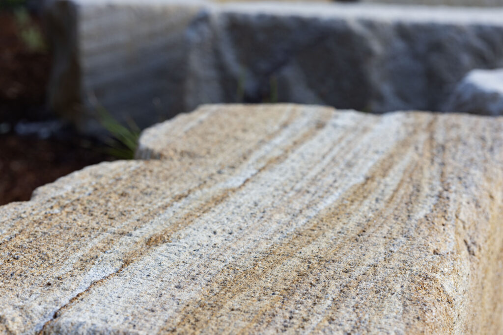 Macro detail of sandstone grain and striping used in the John Hunter Hospital seating