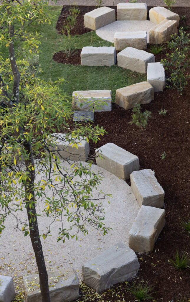 Yarning circle seating at John Hunter Hospital, viewed from above beneath the tree canopy