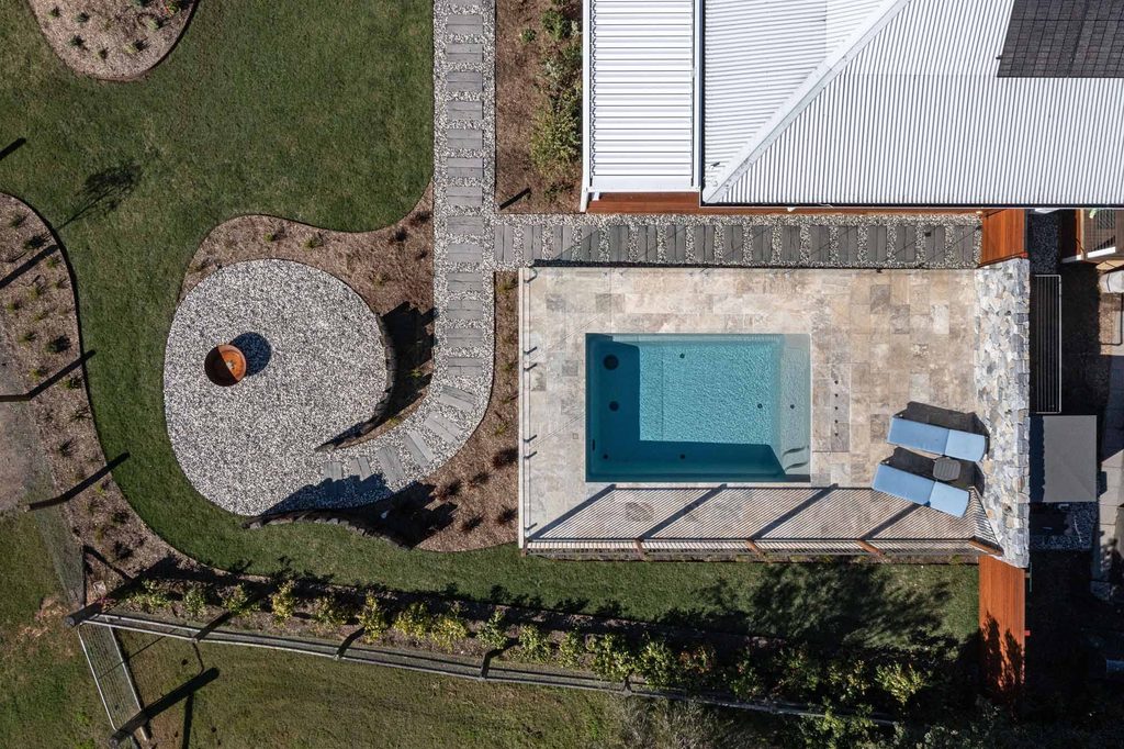 Overhead view of pool and firepit areas connected by a stepping stone pathway in Pokolbin