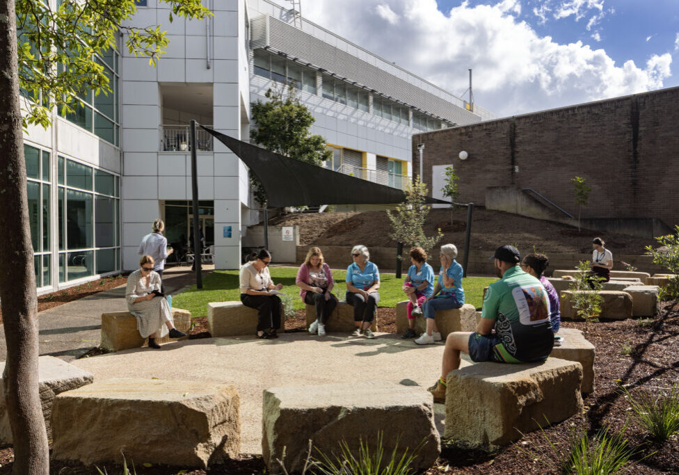 Staff and volunteers gathered in the yarning circle at John Hunter Hospital