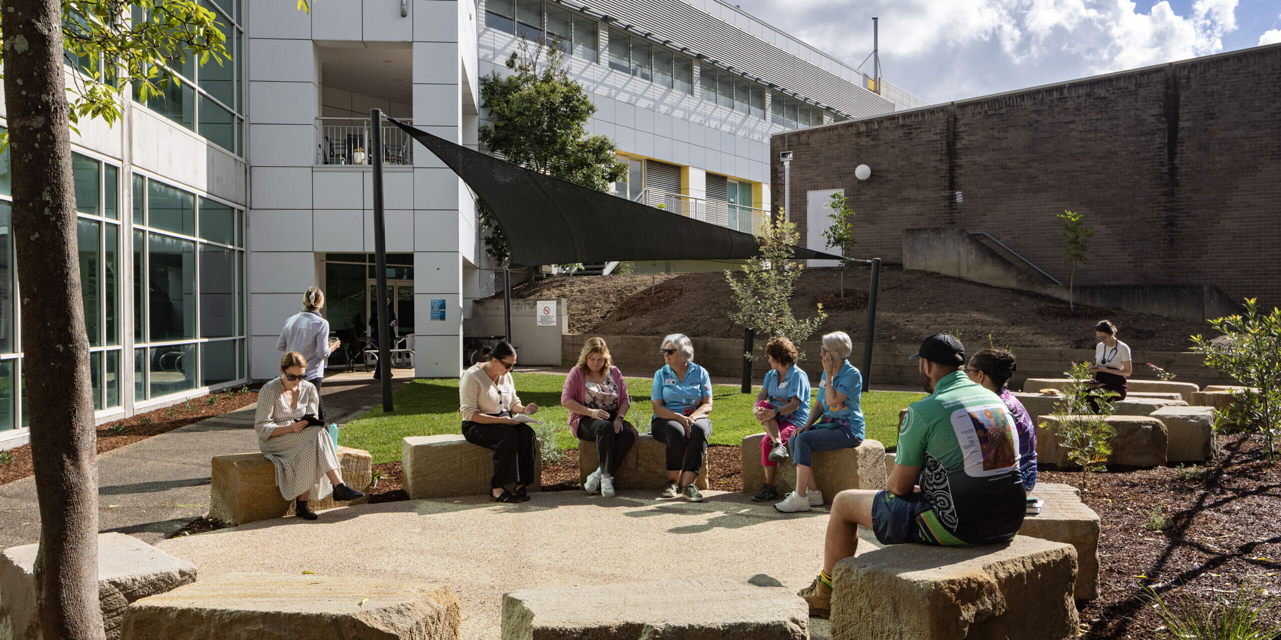 Staff and volunteers gathered in the yarning circle at John Hunter Hospital